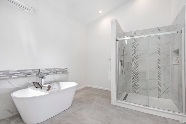 bathroom with tile patterned floors, tile walls, independent shower and bath, a wall mounted AC, and vaulted ceiling