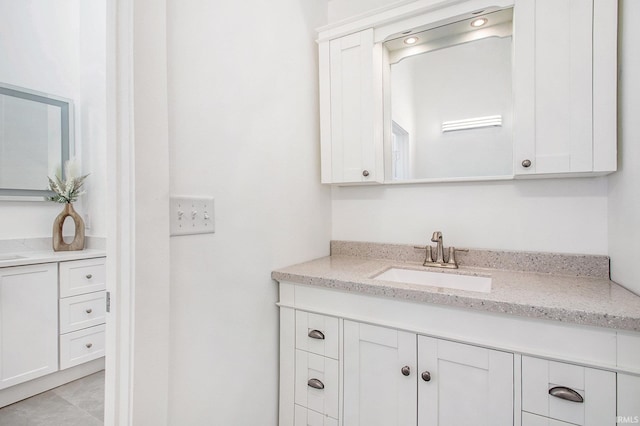 bathroom featuring vanity and tile patterned flooring