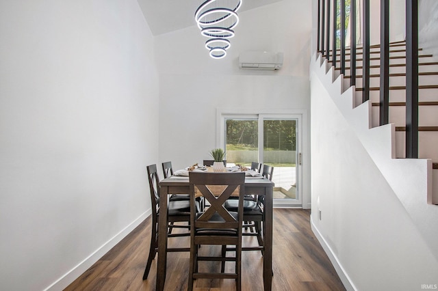 dining room with dark hardwood / wood-style flooring, an inviting chandelier, an AC wall unit, and vaulted ceiling