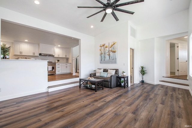 living room featuring wood-type flooring, ceiling fan, and high vaulted ceiling