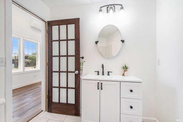 bathroom with vanity and hardwood / wood-style floors