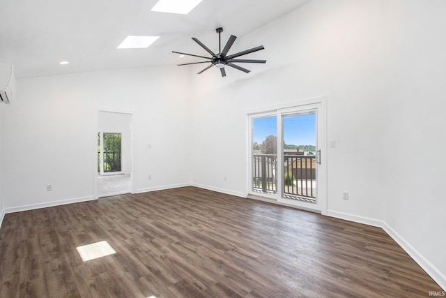 empty room with a skylight, a wealth of natural light, high vaulted ceiling, and dark wood-type flooring