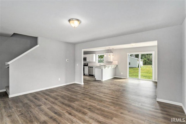 unfurnished living room featuring hardwood / wood-style floors