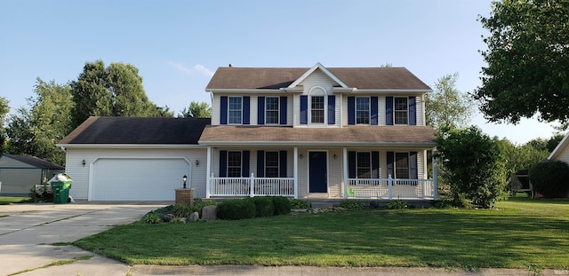 colonial-style house with a garage, covered porch, and a front yard