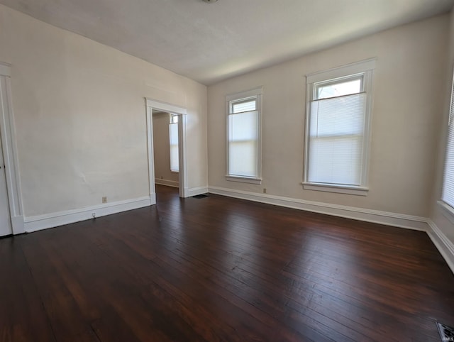 empty room with wood-type flooring