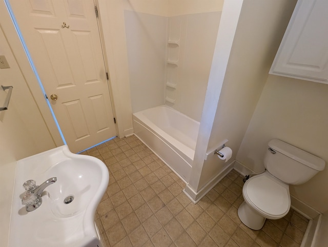 bathroom with toilet, tile patterned flooring, and  shower combination