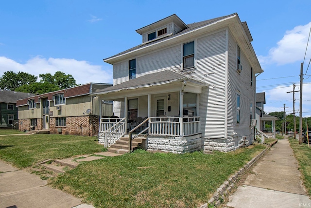 view of front of house featuring a porch and a front yard