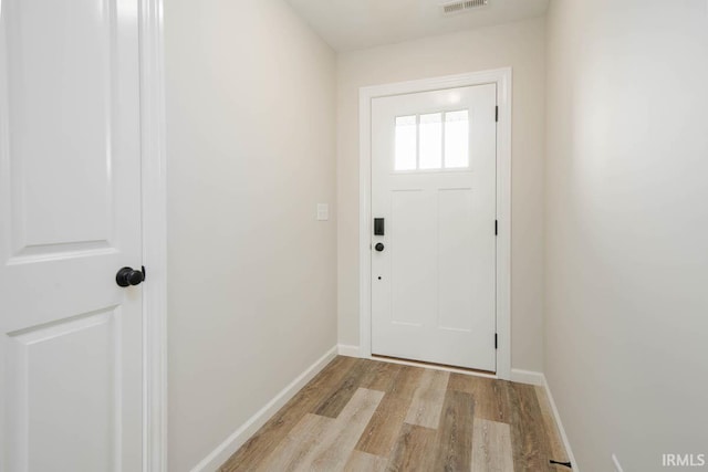 doorway to outside featuring light wood-type flooring