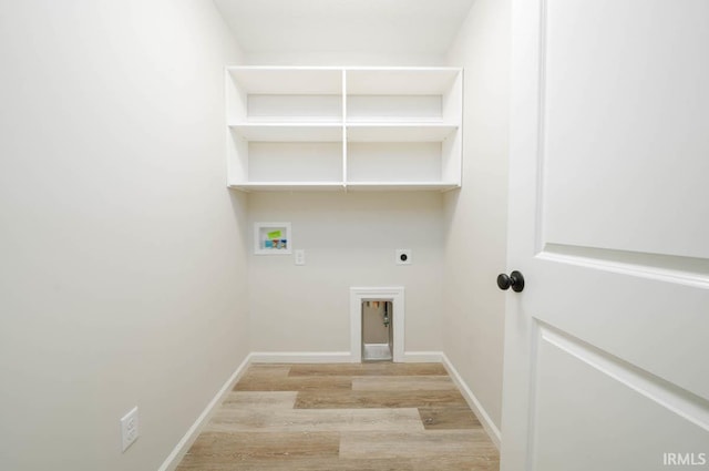 laundry room featuring washer hookup, light wood-type flooring, and electric dryer hookup