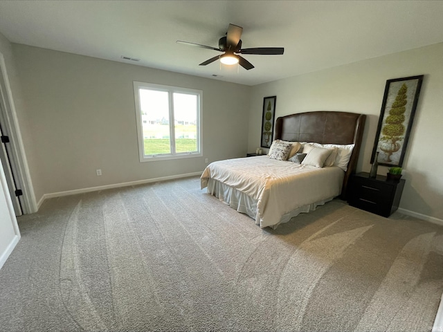 bedroom with ceiling fan and light colored carpet