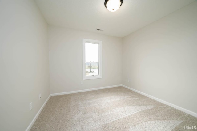 spare room featuring carpet floors