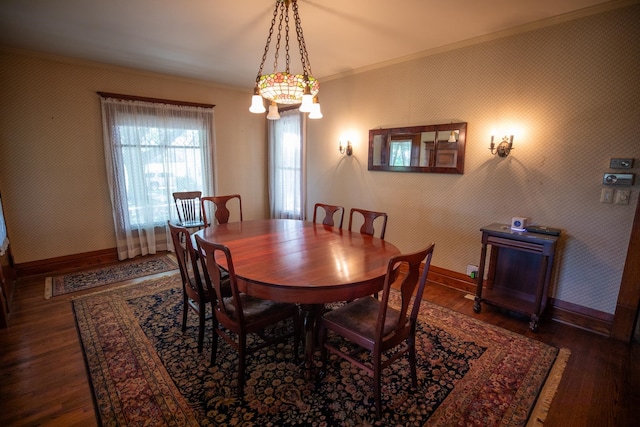 dining room with dark hardwood / wood-style floors and ornamental molding