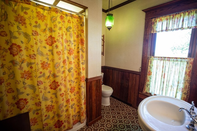 bathroom featuring tile patterned flooring and toilet