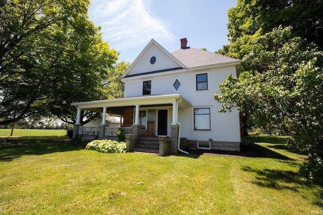 farmhouse featuring a porch and a front lawn