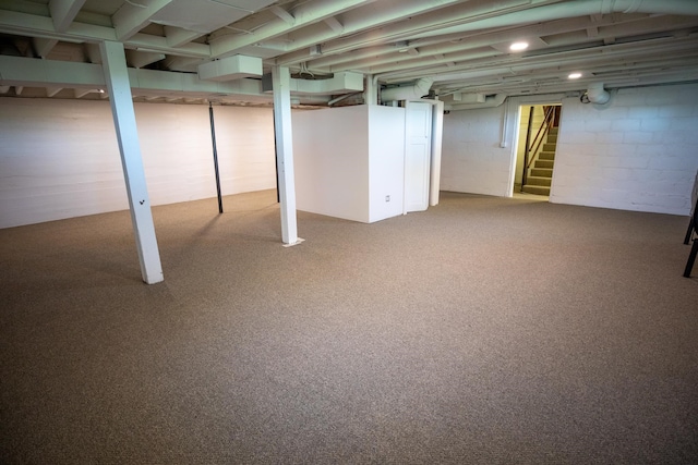 basement with light colored carpet