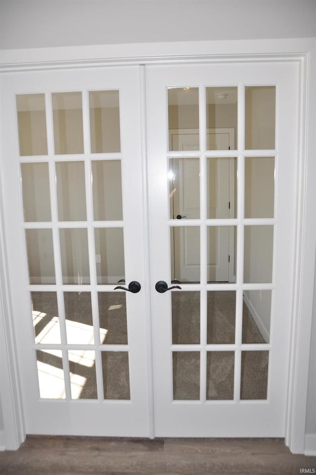 room details with hardwood / wood-style floors and french doors