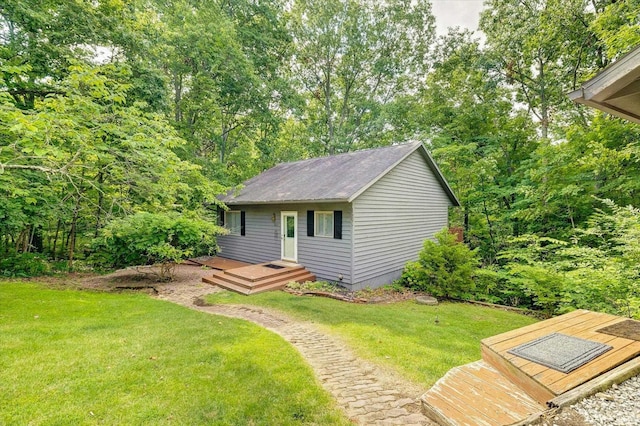 view of outbuilding with a lawn