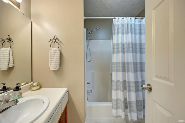 bathroom featuring shower / bath combo with shower curtain and vanity