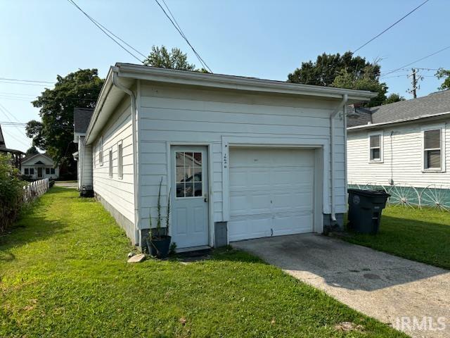 garage with a lawn