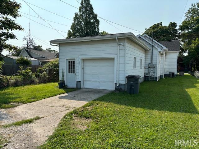 garage featuring a yard