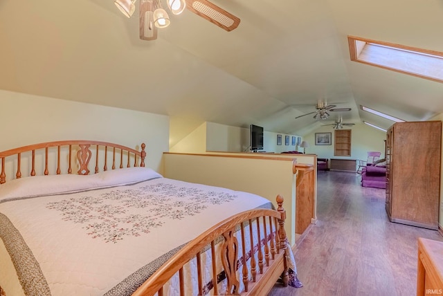 bedroom with wood-type flooring, lofted ceiling, and ceiling fan