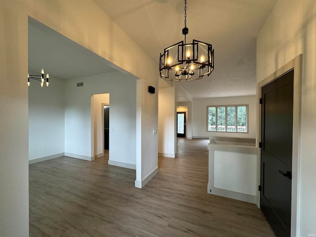 interior space featuring a notable chandelier and hardwood / wood-style floors