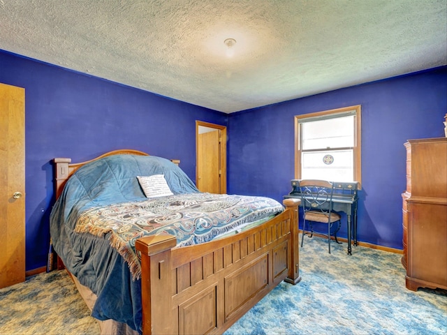 carpeted bedroom with a textured ceiling