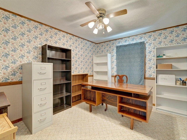 office space featuring crown molding, ceiling fan, carpet floors, and a textured ceiling