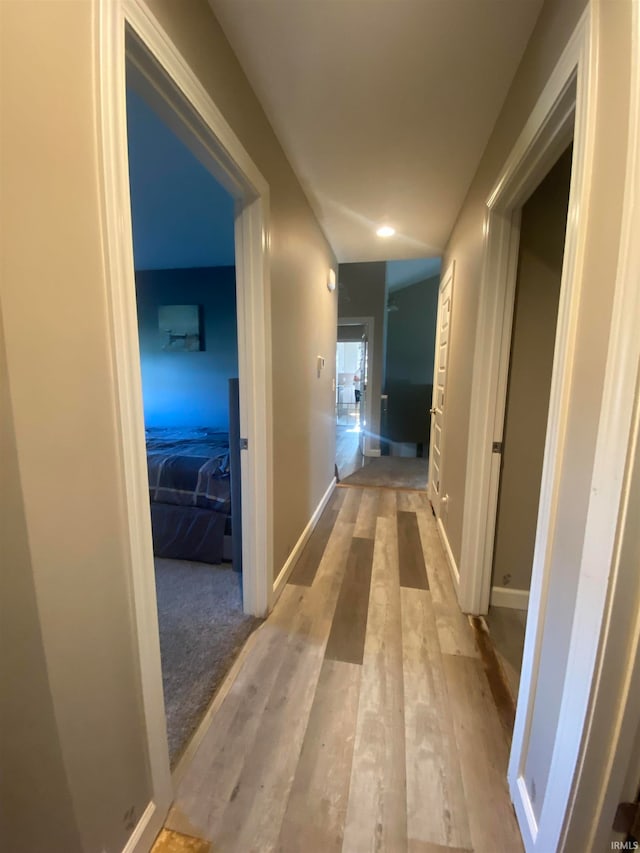 corridor with light wood-type flooring