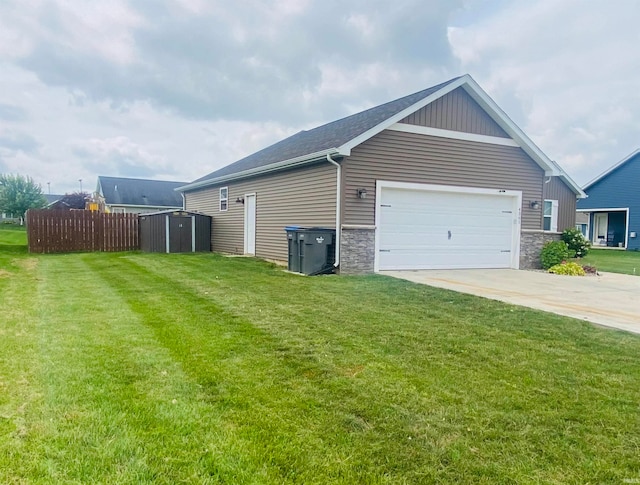 view of home's exterior featuring a yard and a garage