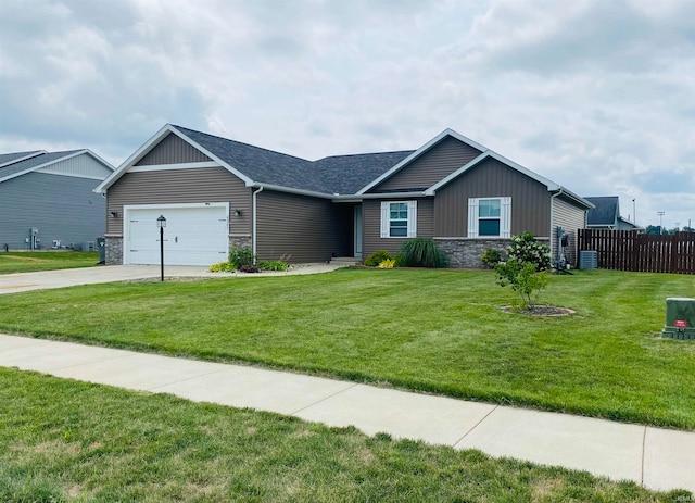 ranch-style home featuring a garage and a front yard