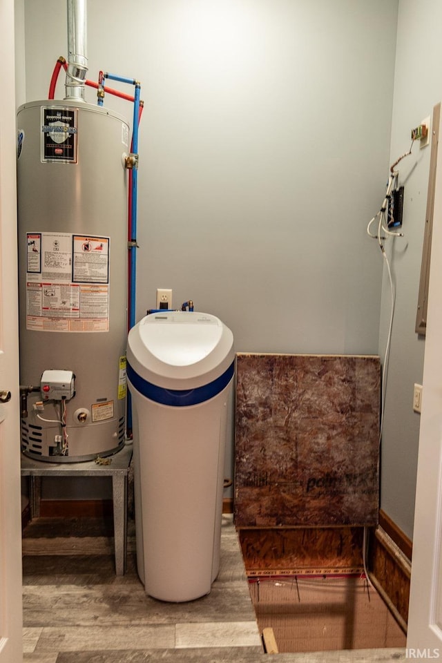 utility room featuring water heater