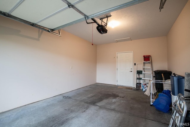 garage featuring a garage door opener