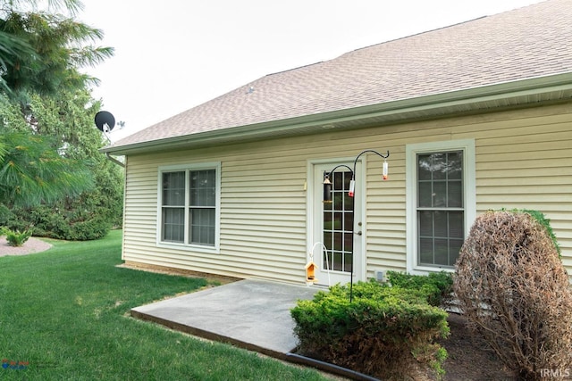 exterior space featuring a lawn and a patio