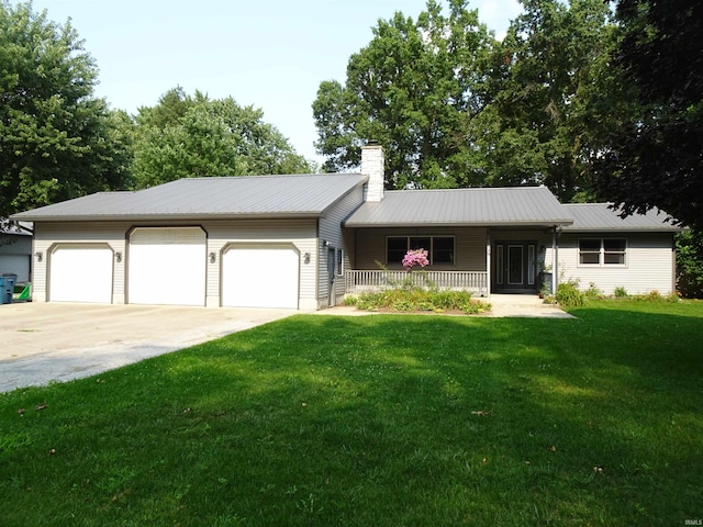 ranch-style house featuring a garage and a front yard