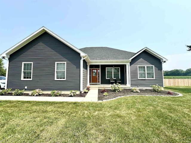 ranch-style home with a porch and a front lawn