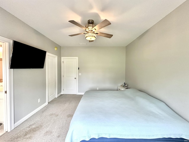 unfurnished bedroom with carpet floors and ceiling fan