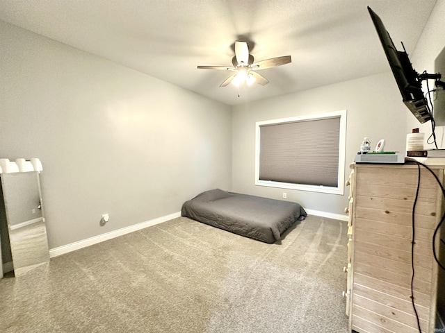 bedroom featuring ceiling fan and carpet flooring