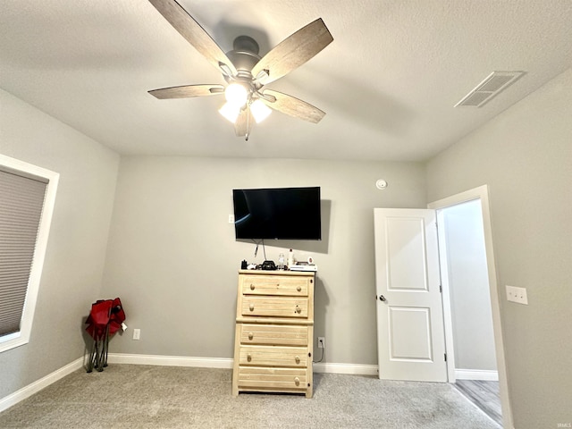 bedroom with ceiling fan and light colored carpet