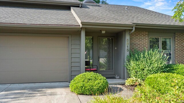 doorway to property featuring a garage