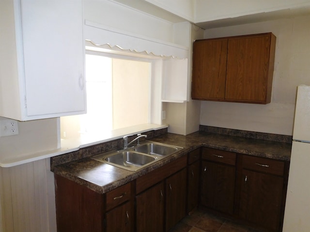 kitchen featuring sink, tile patterned floors, and white refrigerator