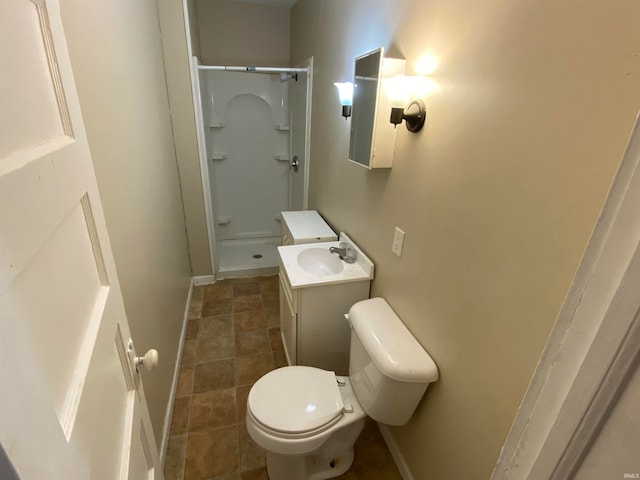 bathroom featuring walk in shower, tile patterned floors, toilet, and vanity