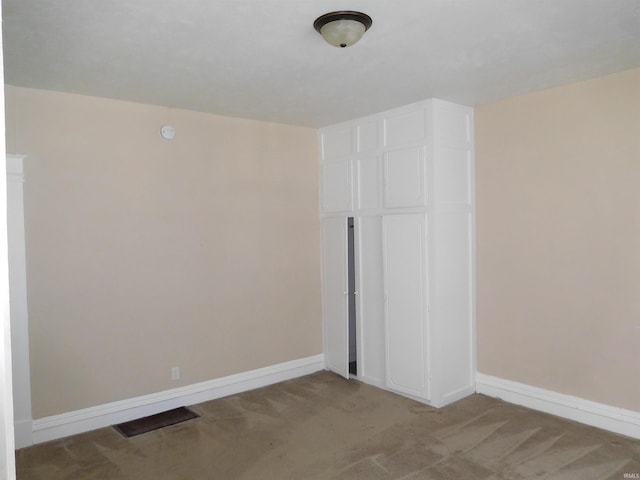 unfurnished bedroom with light carpet