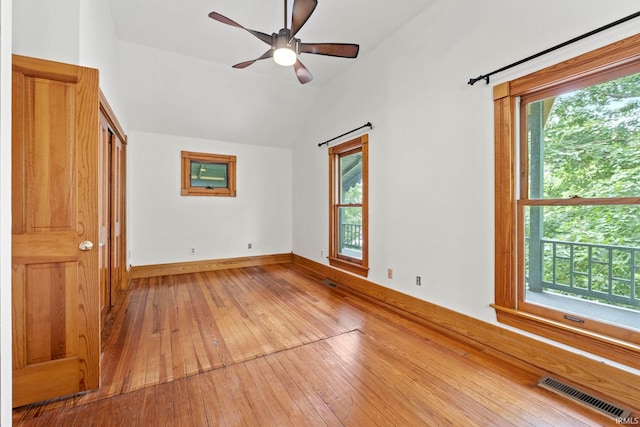 unfurnished room with light wood-style flooring, visible vents, and a wealth of natural light