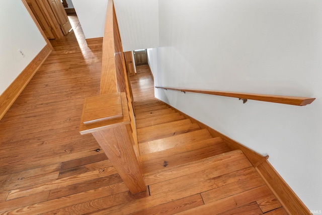 stairway with wood-type flooring