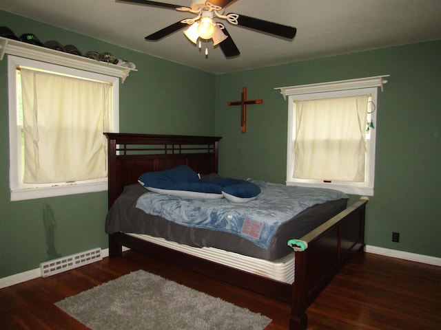 bedroom featuring dark hardwood / wood-style floors and ceiling fan