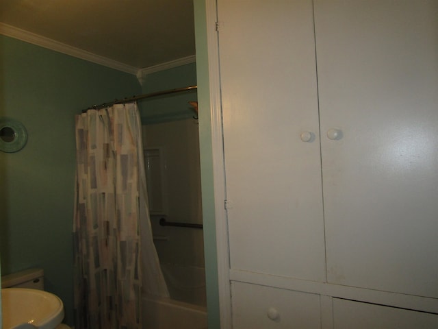 bathroom featuring toilet and ornamental molding