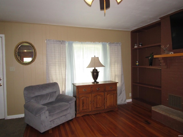 sitting room with dark hardwood / wood-style floors