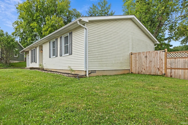 view of home's exterior featuring a lawn