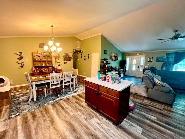 kitchen featuring light hardwood / wood-style flooring and ornamental molding